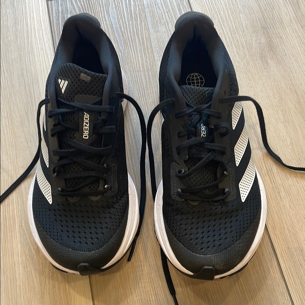 Adidas Black and White Athletic Shoes with Classic Stripes
